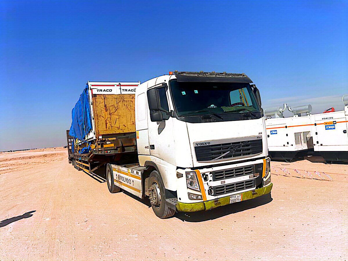 Flatbed convoy delivering industrial equipment